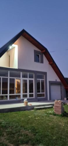 a large white house with a lot of windows at Sarajevo NATURE Romanija in Sarajevo
