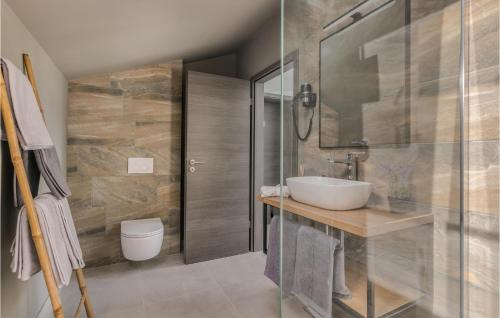 a bathroom with a sink and a shower at Awesome Home In Klimno With Kitchen in Klimno
