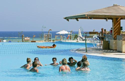 a group of people in a swimming pool at Three Corners Fayrouz Plaza Beach Resort in Port Ghalib