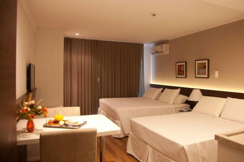 Ένα ή περισσότερα κρεβάτια σε δωμάτιο στο Atmosfera Hotel