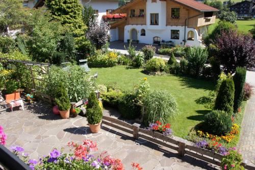 an aerial view of a garden with flowers and plants at Haus Konrad in Reith im Alpbachtal