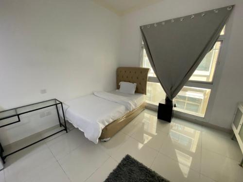 Postel nebo postele na pokoji v ubytování Furnished Studio Apartments for rent in Dubai