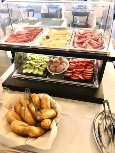 a display case with many different types of food at Hotel President in Cervia