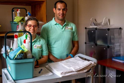 a man and woman standing next to a hospital table at Il Giardino della Tartaruga in Genova