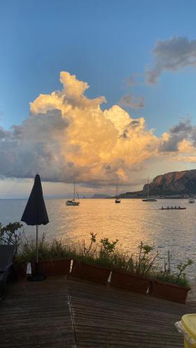 a view of a large body of water with boats at The White Sail - Mondello Apartment with Terrace - casa di vincenzo e andrea in Mondello