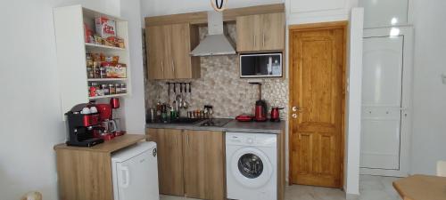 a kitchen with a washing machine and a washer at Beautiful Choice - near Athens airport - 50m from the sea - IQ+ in Artemida