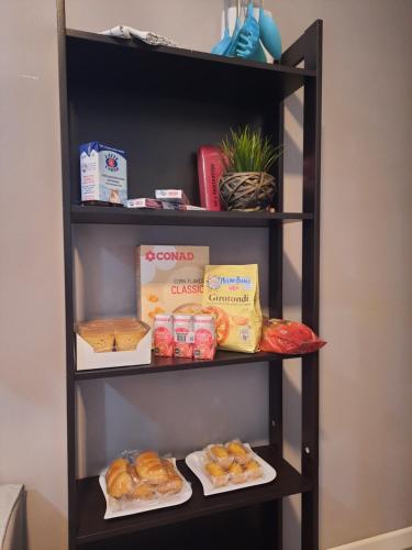 a shelf filled with different types of food at Siore Marie gli alloggi in San Giórgio di Nogaro