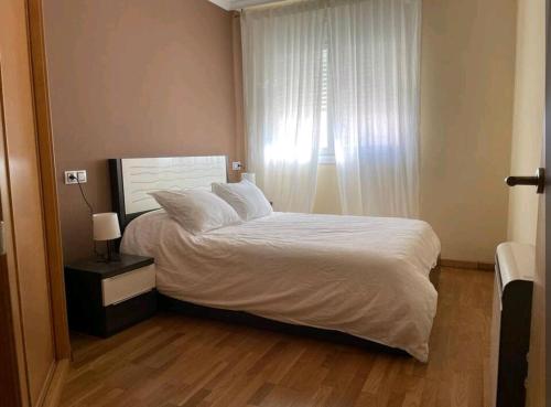 Posteľ alebo postele v izbe v ubytovaní Cozy flat in Boiro near the beach