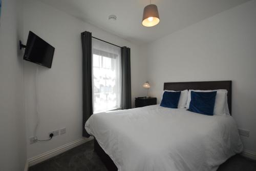 a bedroom with a large bed and a window at Eagle Ensuite Room in Tobermory