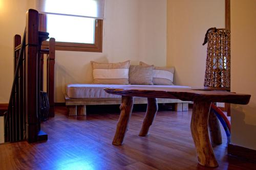 a living room with a couch and a table at Esperides Parga Studios in Parga