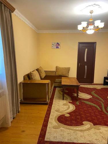 a living room with a couch and a table at House Abel in Tsaghkadzor