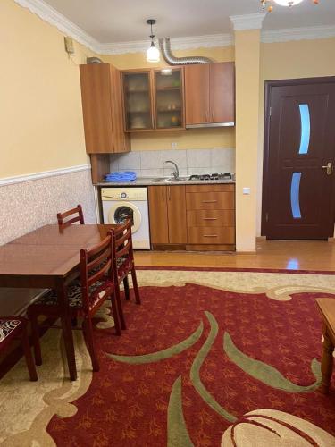 a kitchen with a table and chairs and a dining room at House Abel in Tsaghkadzor