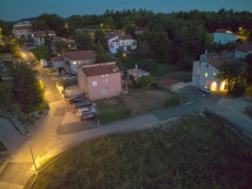 an aerial view of a city at night with cars parked at Middle Istra in Pazin