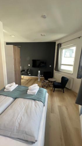 a bedroom with a bed and a living room at My Apartment im Bremer Viertel in Bremen
