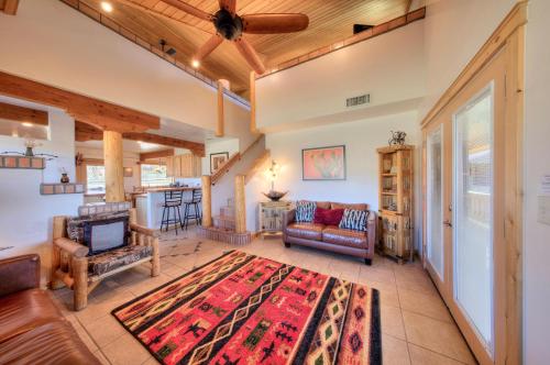 a living room with a couch and a table at Pack Creek ~ Orchard House in Moab