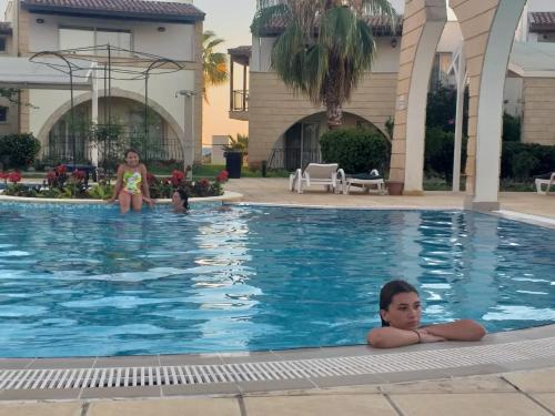two girls in the swimming pool at a hotel at Boheme B6 Sunrise Beach in Kalecik