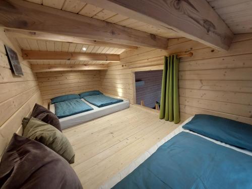 a room with two beds in a sauna at Chalet im Spiel- und Obstgarten in Keidelheim