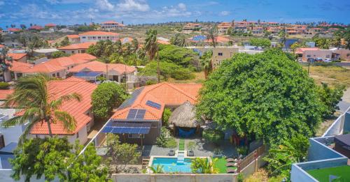 an aerial view of a house with orange roofs at Lama y Solo Unique private room walking distance to the Beach in Palm-Eagle Beach