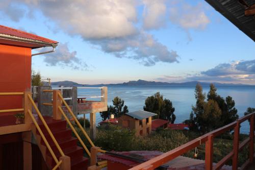 a view of the water from a house at AMANTANI LODGE LoveLand in Amantani