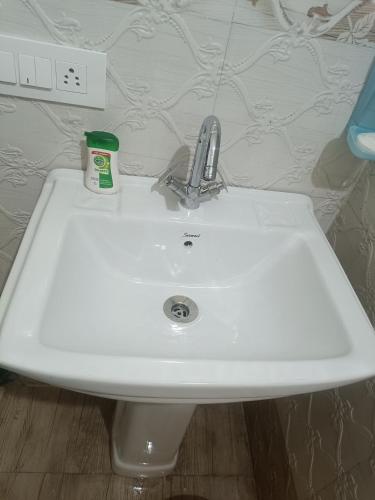 a bathroom sink with a faucet on top of it at Peace holiday homestay in Chail
