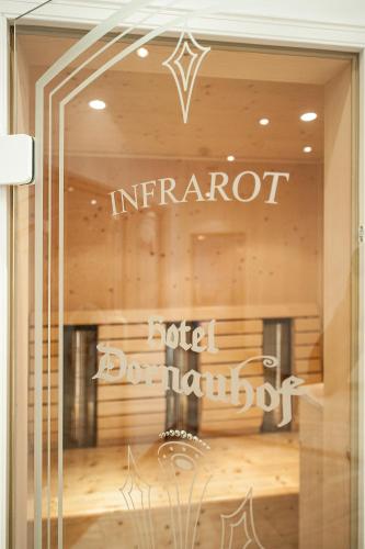 a window of a store with the words imperialord conducted durham at Hotel Dornauhof in Finkenberg