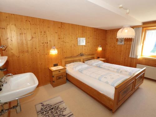A bed or beds in a room at Ferienhaus Türtscher 2