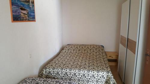 a small room with a bed in the corner at Seaside secluded apartments Cove Skozanje, Hvar - 4624 in Gdinj