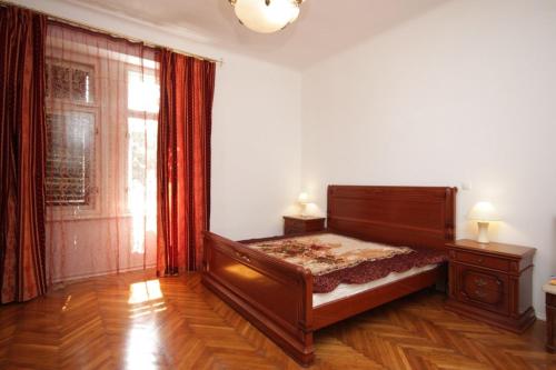 a bedroom with a bed and a large window at Apartments with a parking space Opatija - 3436 in Opatija