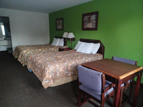 Ένα ή περισσότερα κρεβάτια σε δωμάτιο στο America's Best Value Inn Clarksdale