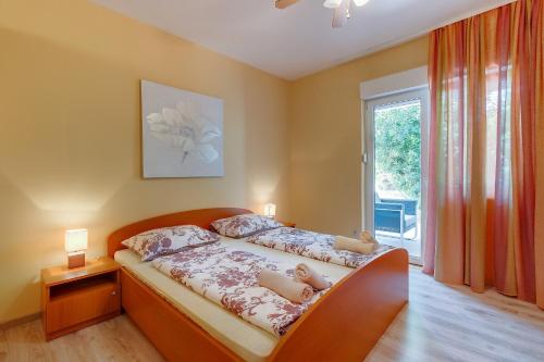 Posteľ alebo postele v izbe v ubytovaní Apartments with a parking space Mali Losinj (Losinj) - 3441