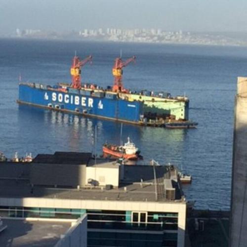 a large blue container ship in the water at Departamento Cerro Alegre 113 in Valparaíso