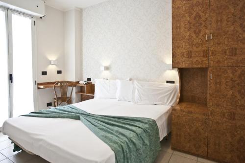 Postel nebo postele na pokoji v ubytování Hotel Aurora