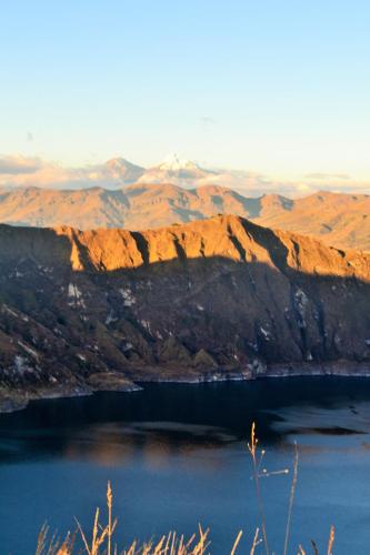 a view of a lake with mountains in the background at Hotel PrincesaToa in Quilotoa