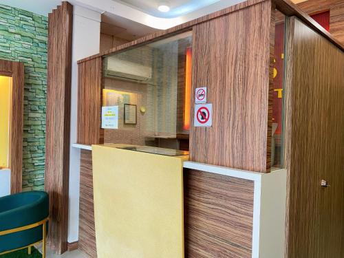 a lobby with a door with a no smoking sign at Best Hotel in Skudai