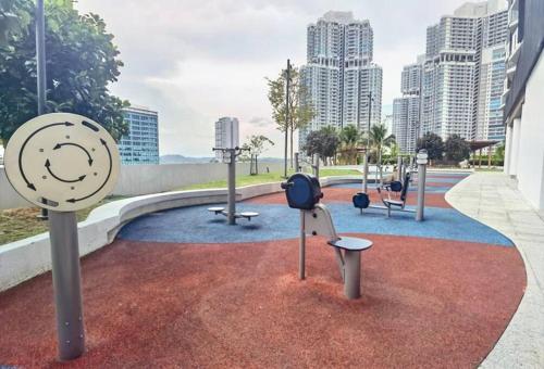 a rendering of a playground with a clock on the ground at 1719 Almas Suites Muji Studio100mbpsNetflix By STAY in Nusajaya