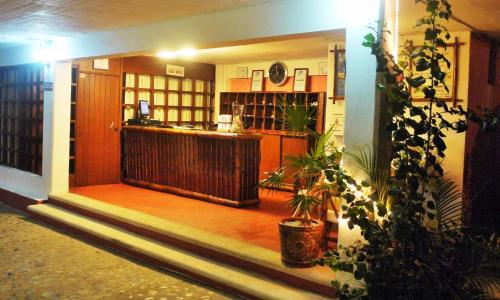 a entrance to a room with a bar in a building at Hotel Casa Sun and Moon in Zihuatanejo