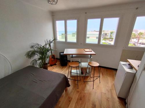 Posedenie v ubytovaní Cosy studio en étage résidence front de mer