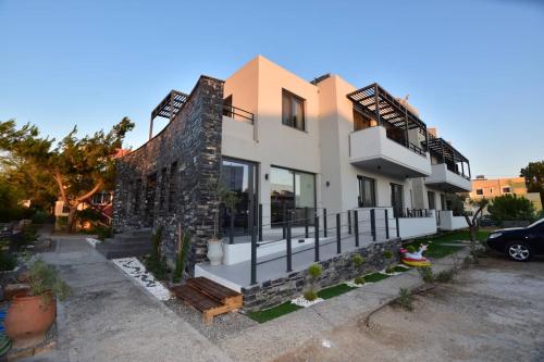 a house with a stone wall at Mediterranean Dream in Palaiochora