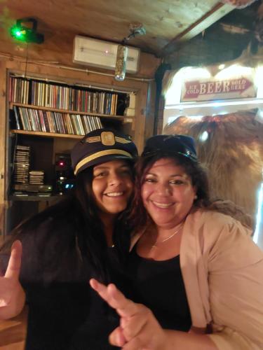 two women are standing next to each other at Alpenlandhotel Rodeneggerhof in Rodengo