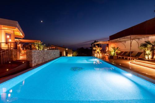 a swimming pool in a house at night at A Casa Di Mà in Lumio