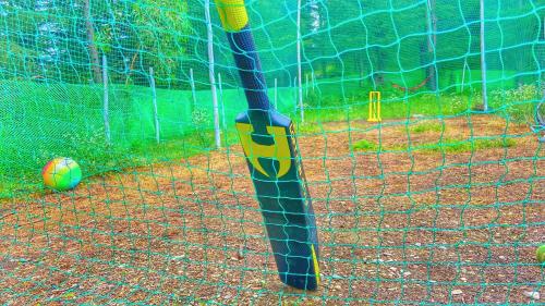 a baseball bat in a batting cage with a ball at HANO Peak in Nāldera