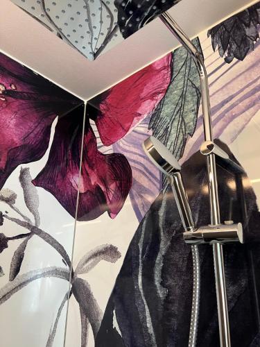 a woman is standing under an umbrella at Apartment Siegfried in Bayreuth