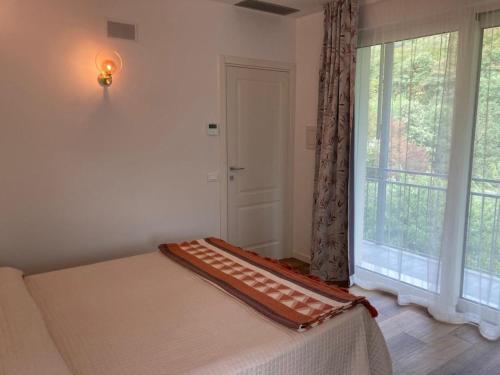 Letto o letti in una camera di BiancoGelso b&b Vegan