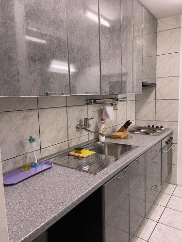 Kuchyň nebo kuchyňský kout v ubytování SEA VIEW APARTMENT