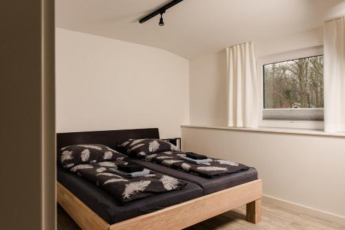 Ένα ή περισσότερα κρεβάτια σε δωμάτιο στο Strandappartements Steinberghaff "Kegnæs" mit Meerblick und Sauna