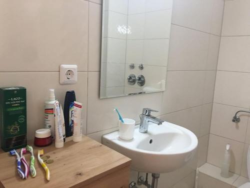 a bathroom with a sink and a mirror at Ferienwohnung in Kiel in Kiel