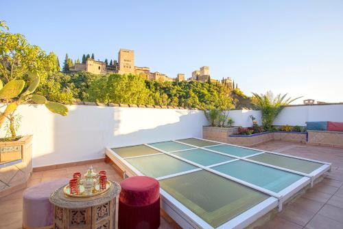 a tennis court on the roof of a building at Morayma House Terrace with views to Alhambra in Granada