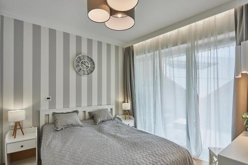 Ένα ή περισσότερα κρεβάτια σε δωμάτιο στο Apartamenty Świnoujście - Bałtycki