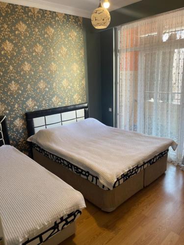 Postel nebo postele na pokoji v ubytování Batumi centre