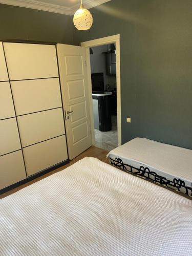 Postel nebo postele na pokoji v ubytování Batumi centre